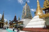 The Mahabodhi Paya is built in the style of the famous Mahabodhi Temple in Bodhgaya, India.<br/><br/>

The golden stupa of the Shwedagon Pagoda rises almost 100 m (330ft) above its setting on Singuttara Hill and is plated with 8,688 solid-gold slabs. This central stupa is surrounded by more than 100 other buildings, including smaller stupas and pavilions.<br/><br/>

The pagoda was already well established when Bagan dominated Burma in the 11th century. Queen Shinsawbu, who ruled in the 15th century, is believed to have given the pagoda its present shape. She also built the terraces and walls around the stupa.<br/><br/>

The giant stupa has a circumference at platform level of 433 m (1,420ft), with its octagonal base ringed by 64 smaller stupas.