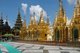 The golden stupa of the Shwedagon Pagoda rises almost 100 m (330ft) above its setting on Singuttara Hill and is plated with 8,688 solid-gold slabs. This central stupa is surrounded by more than 100 other buildings, including smaller stupas and pavilions.<br/><br/>

The pagoda was already well established when Bagan dominated Burma in the 11th century. Queen Shinsawbu, who ruled in the 15th century, is believed to have given the pagoda its present shape. She also built the terraces and walls around the stupa.<br/><br/>

The giant stupa has a circumference at platform level of 433 m (1,420ft), with its octagonal base ringed by 64 smaller stupas.